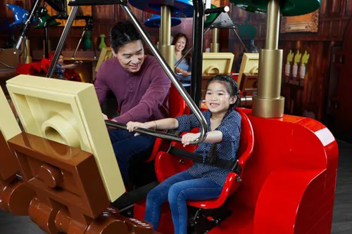 Father and Daughter on Merlins Apprentice Ride at LEGOLAND Discovery Centre